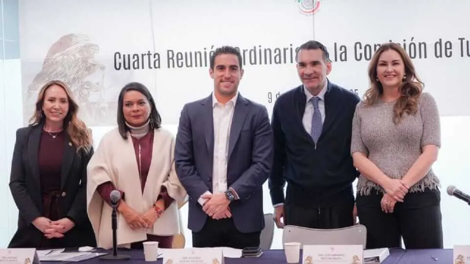 Senate advances major overhaul of beach access in Mexico Five people stand at a formal panel discussion with microphones and a backdrop displaying Spanish text about a governmental meeting