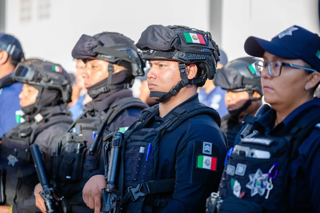 Law enforcement officers in tactical gear and helmets stand in formation during a security briefing