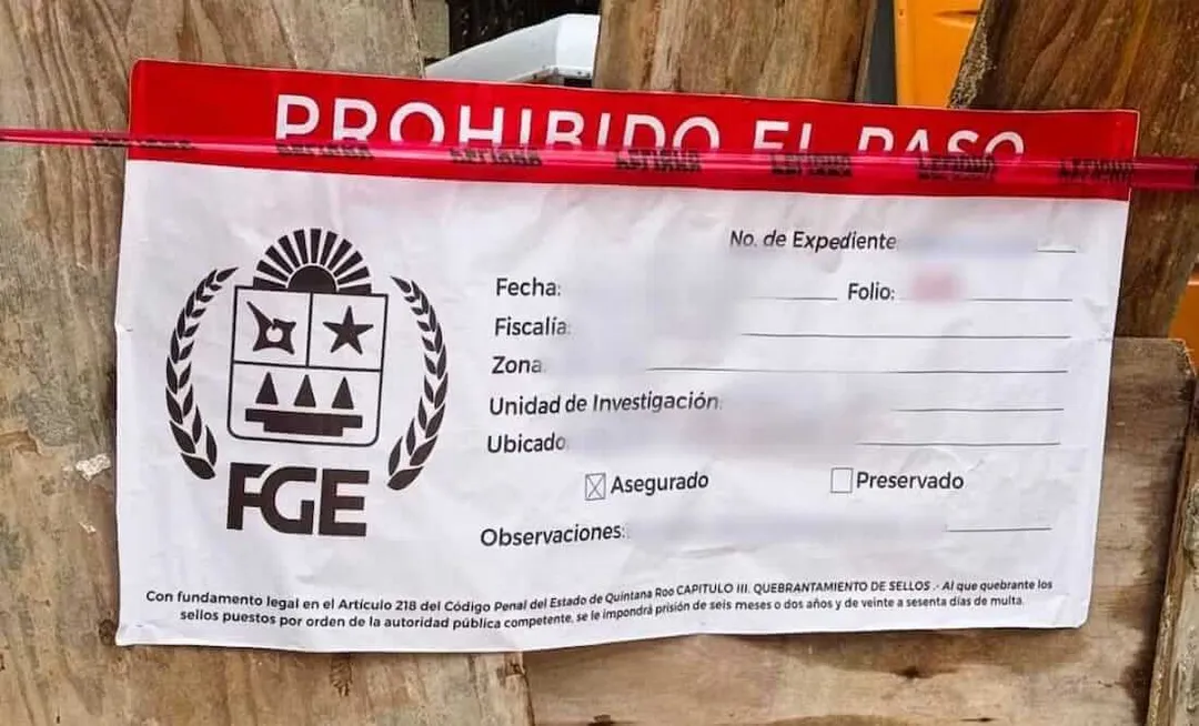 Official red and white evidence seal with FGE logo attached to wooden surface, prohibiting passage due to legal action