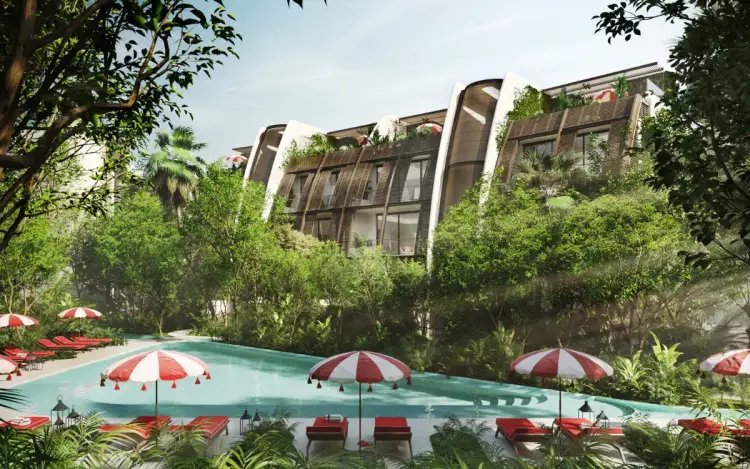 Modern curved residential buildings with green vegetation rise above a resort pool surrounded by red and white umbrellas and lounge chairs Modern curved residential buildings with green vegetation rise above a resort pool surrounded by red and white umbrellas and lounge chairs