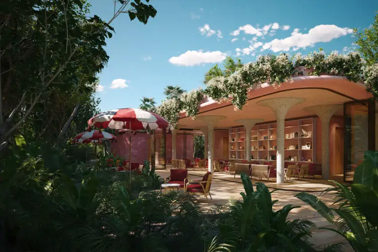 A terracotta-colored modern building with curved architecture and shelving sits amid lush tropical vegetation, with red umbrellas and seating visible on the sur A terracotta-colored modern building with curved architecture and shelving sits amid lush tropical vegetation, with red umbrellas and seating visible on the sur