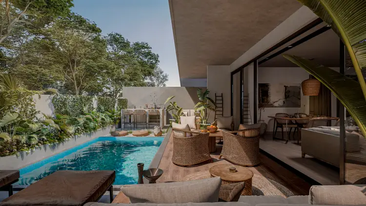 Modern residential property with a blue swimming pool, lounge seating, woven chairs, and an open-plan indoor-outdoor living space surrounded by tropical vegetat Modern residential property with a blue swimming pool, lounge seating, woven chairs, and an open-plan indoor-outdoor living space surrounded by tropical vegetat