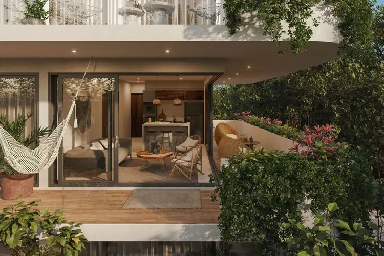 Modern residential courtyard with open-concept living space, hammock, and planted garden beds surrounding a contemporary home interior Modern residential courtyard with open-concept living space, hammock, and planted garden beds surrounding a contemporary home interior