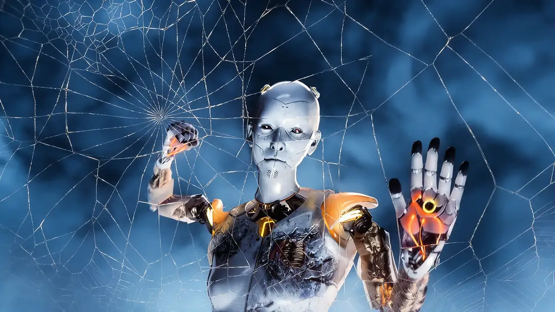The truth behind Anyma's visual effects Robot with white face and metallic hands touching a shattered glass surface against a blue digital background