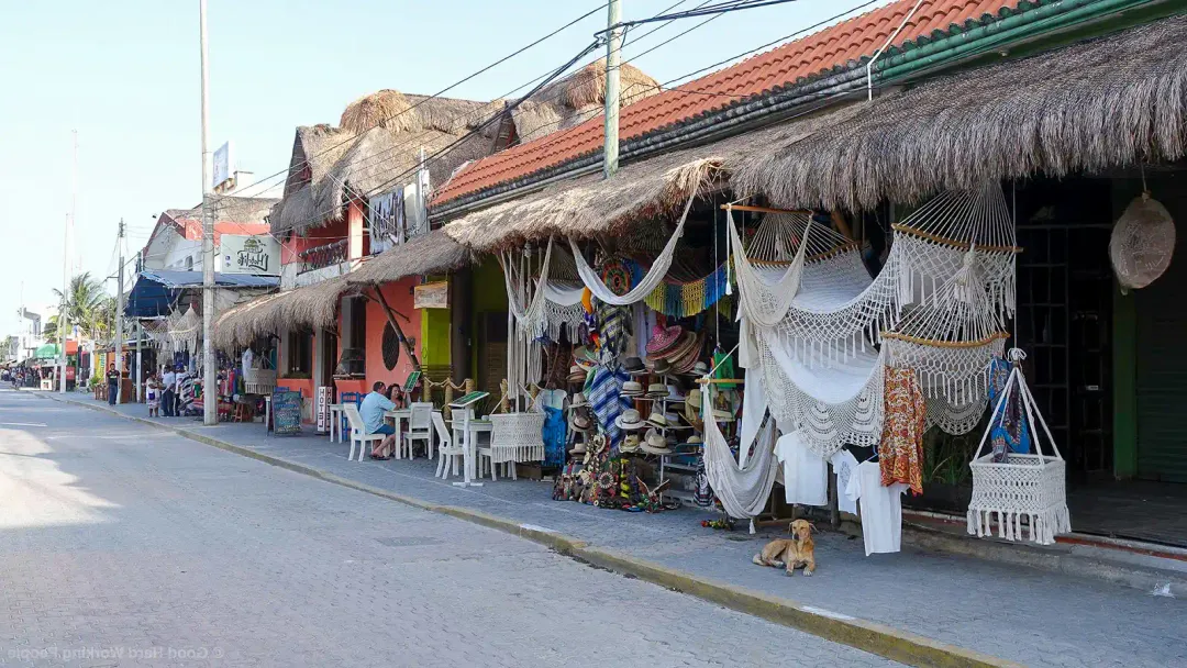 Tulum built a reputation on overpricing tourists, now its own businesses are paying for it Beachside shops with thatched roofs display white hammocks and textiles for sale along a quiet street in a tourist area