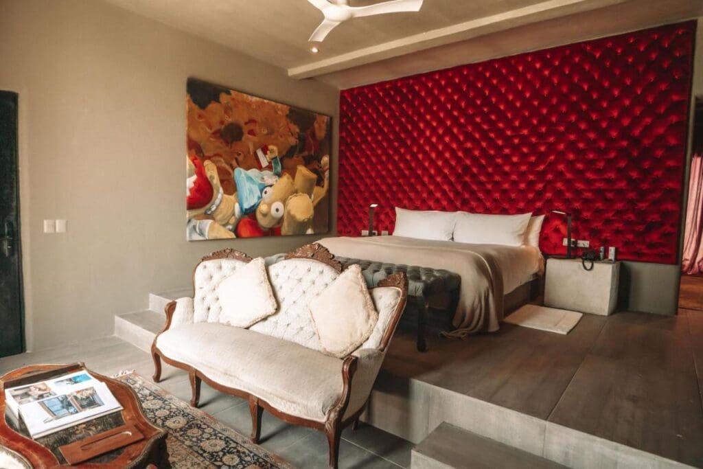Casa Malca in Tulum, once owned by Pablo Escobar, has been transformed into a luxury hotel by art dealer Lio Malca, blending history, art, and luxury.
